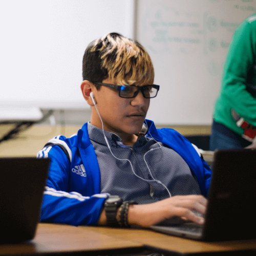 an underrepresented STEM student using his computer