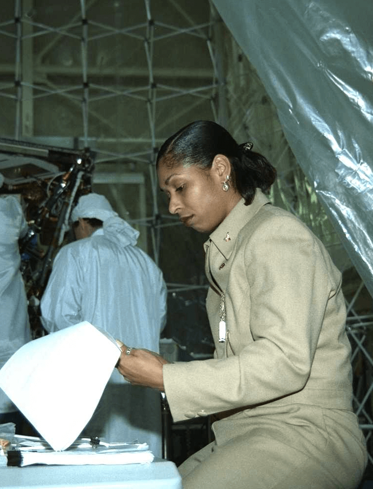 Black female scientist reading